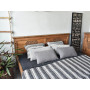 Dřevěná postel do ložnice